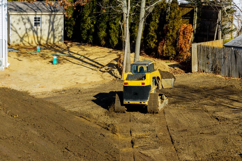 Small tractor digging land working with land